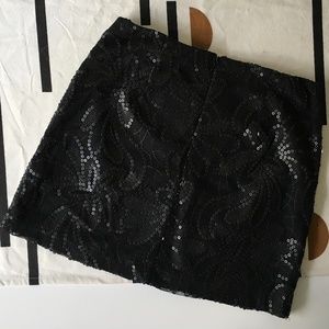 Black sequined mini skirt